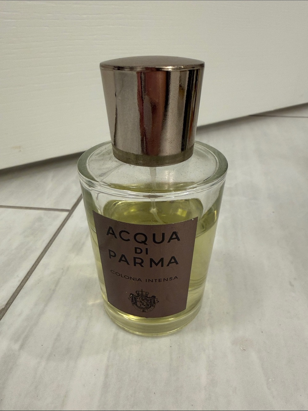 Acqua Di Parma Women’s Bottle with Pale Yellow Liquid and Silver Cap